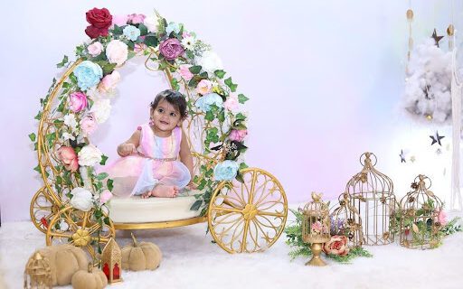 baby sitting in a props for photoshoot
