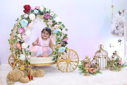 baby sitting in a props for photoshoot